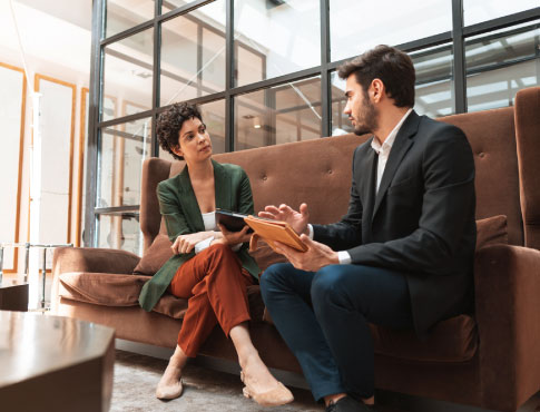 Man talking to woman on couch
